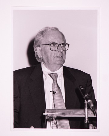 Jeremy Bullmore speaking at a podium
